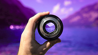 Image of hand holding lens