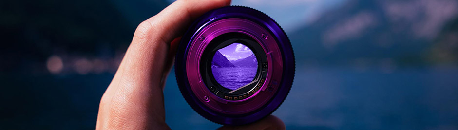 Hand holding a lens