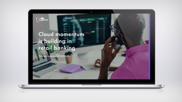 Cloud momentum is building in retail banking Man on phone in front of computer