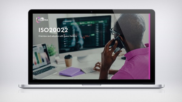 ISO20022: Overview and adoption with Fusion Treasury Man on phone in front of computer