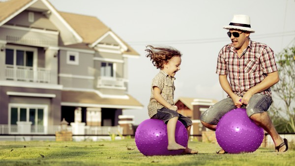 Homebuyers embrace digital lending in COVID-19 era Family having fun in front of home