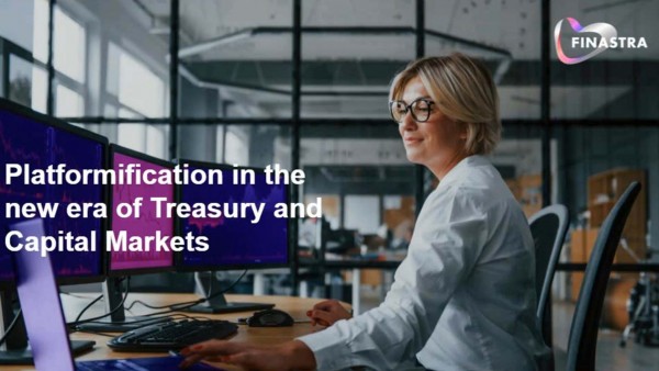 Platformification in the new era of Treasury & Capital Markets Woman infront of multiple computer screens