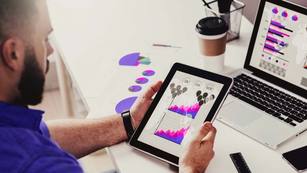 Easing integration woes with cloud-based platforms – a simpler way to meet commercial borrowing needs Man with Tablet