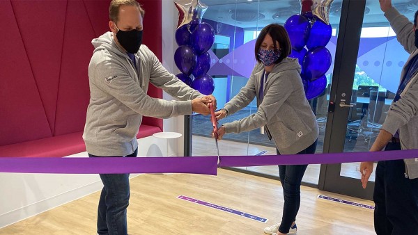 Siobhan , SVP for TEMS, talks about how we have adapted to a new way of working at Finastra Two Finastra employees cutting ribbon