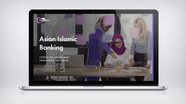 Asian Islamic Banking Image of laptop with 3 women at desk pointing to paper