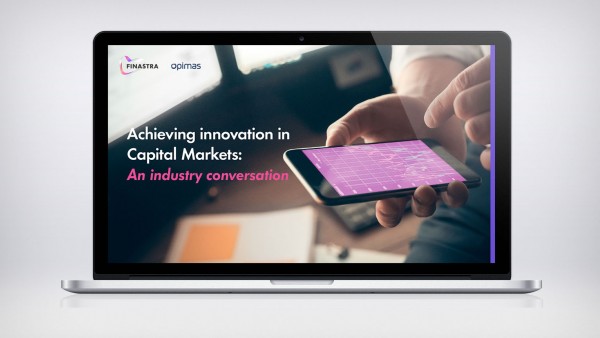 Achieving innovation in Capital Markets: An industry conversation Image of laptop with person holding phone