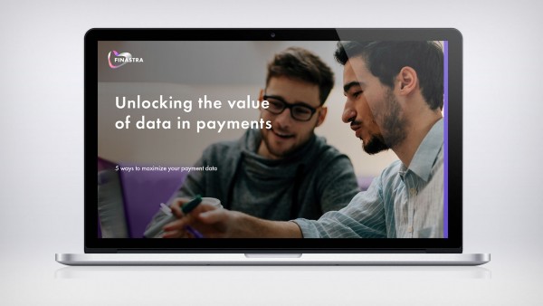 Unlocking the value of data in payments Image laptop with two men talking