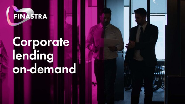 Corporate lending on-demand video Image of 2 men in office looking at paper
