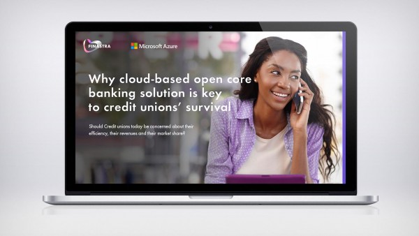 Why cloud-based open core banking solution is key to credit unions’ survival Image of laptop with woman on phone