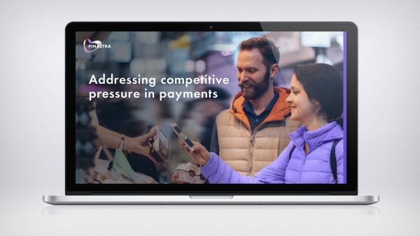Addressing competitive pressures in payments Image of laptop with woman paying with phone