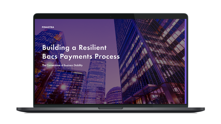 Image of laptop with cover slider of "Building a resilient Bacs payments process: The cornerstone of business stability" eBook