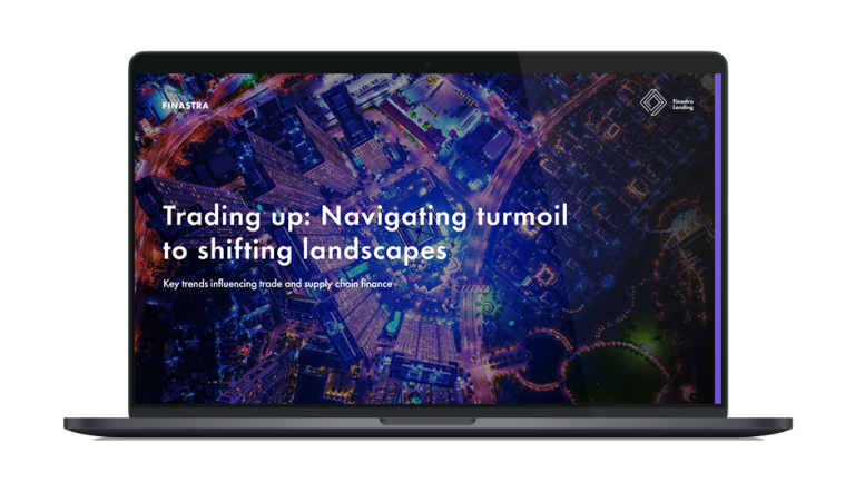 Image of laptop with cover slide of "Trading up: Navigating turmoil to shifting landscapes" white paper