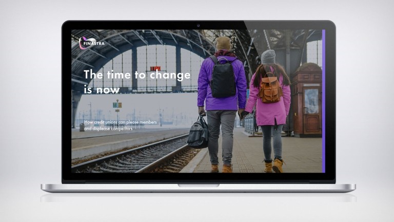 Man and woman holding hands at train station