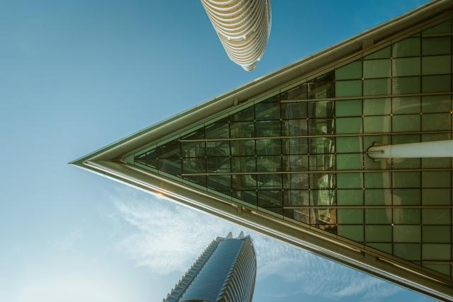 Picture of underside of glass skyscraper