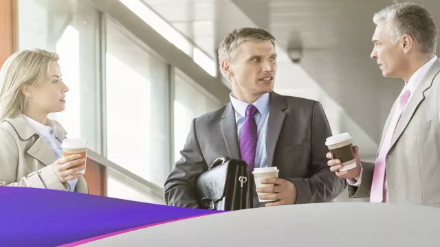 three people talking business