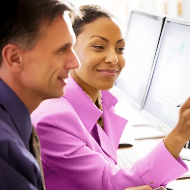 man and woman working in an office