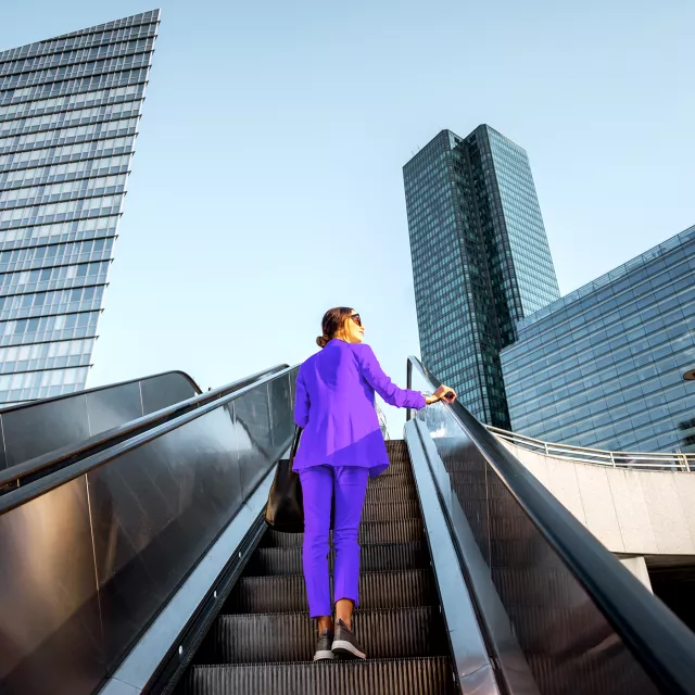 woman on escalator