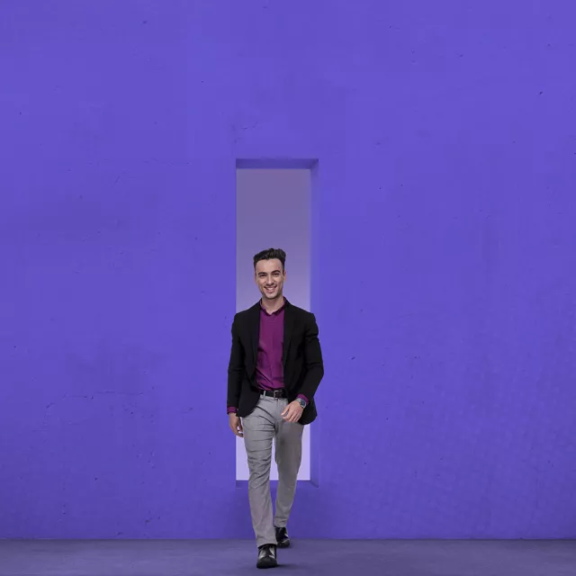 Man walking through doorway