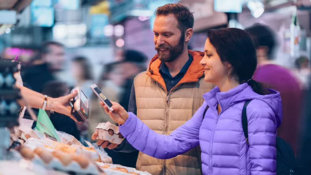 Woman paying with phone