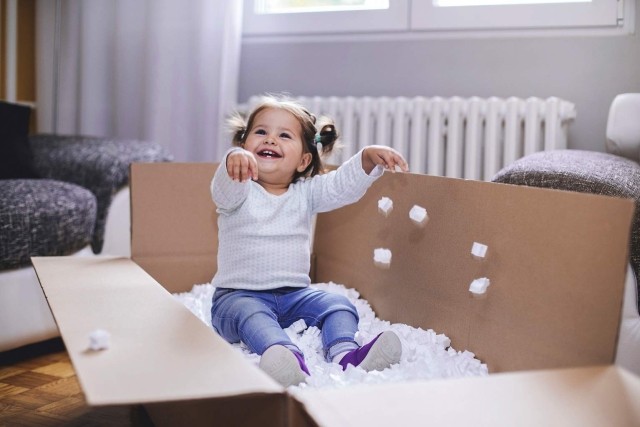 Image of girl playing with foam in box
