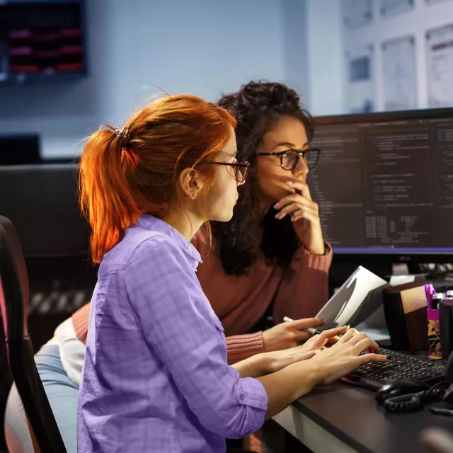 Image of two women working in the office