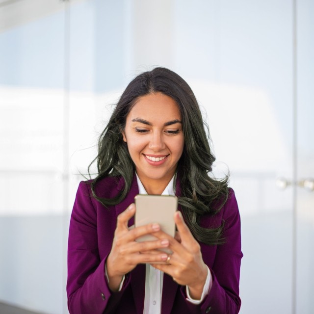 Image of woman on phone smiling