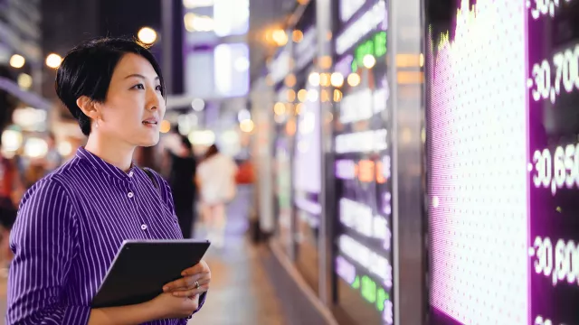 Image of woman looking at stats