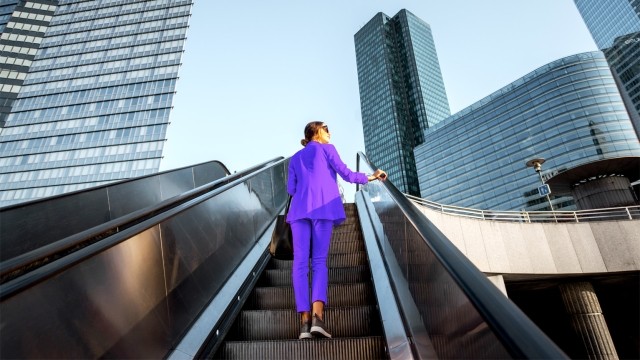 Woman on escalater