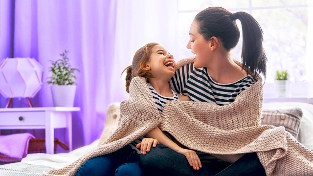 Image of mother and daughter laughing