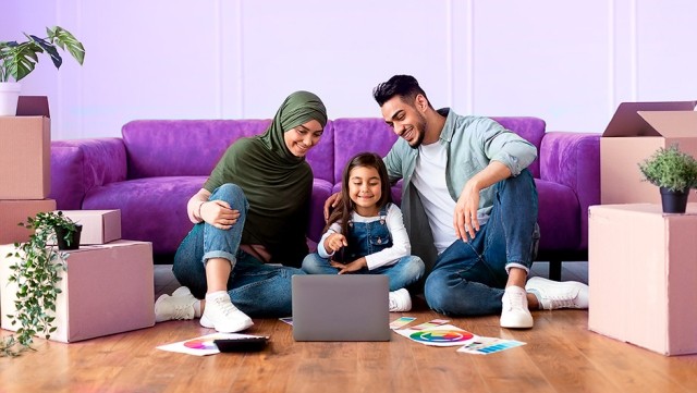 Image of family watching in a laptop