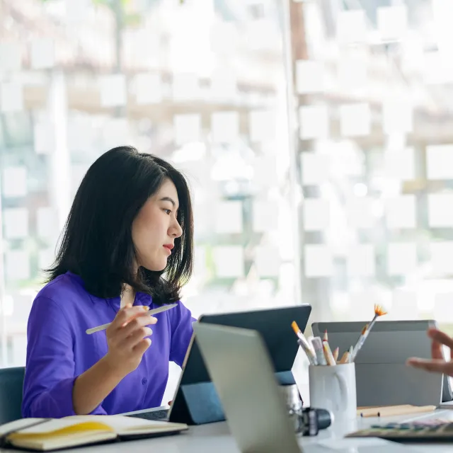 Image of woman working in office