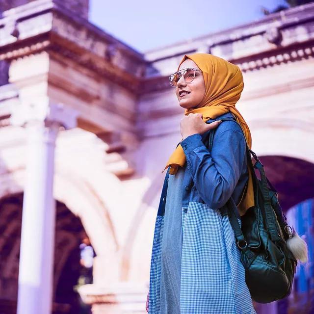 Image of woman walking outdoors
