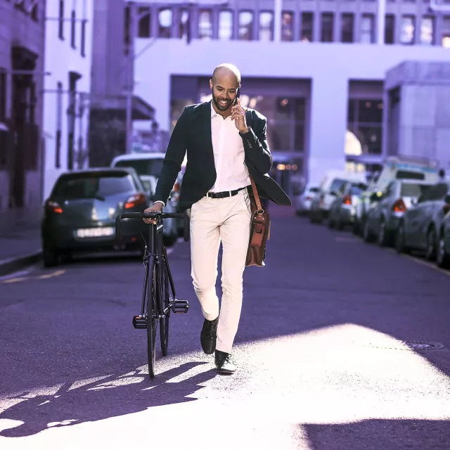 Image of man with his bicycle