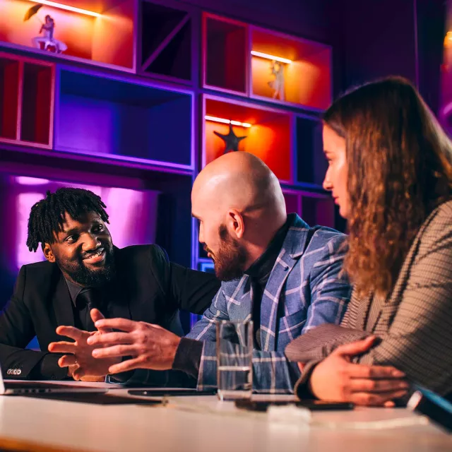 Image of team discussing in an office