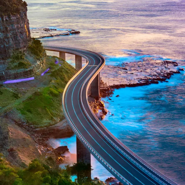 Image of road above a cliff and a beach