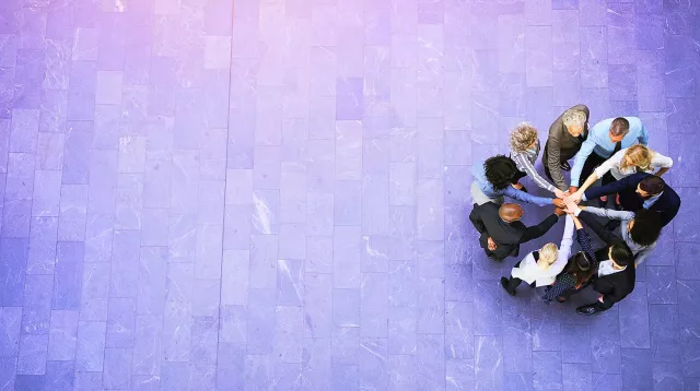 Image of team doing a hand-stack