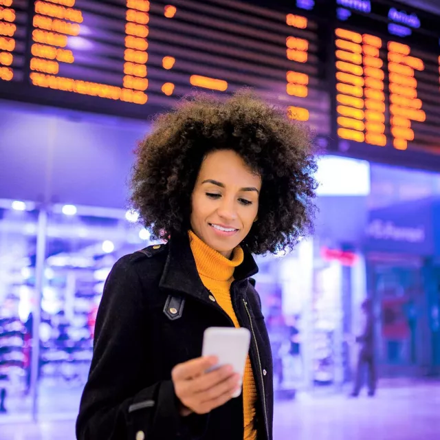Image of woman looking at mobile phone