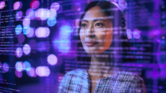 Image of woman looking through a screen of codes