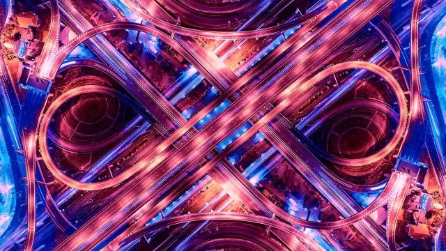 Image of complex highway crossroad at night