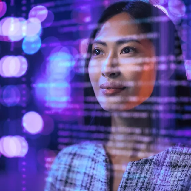 Image of woman looking through a screen of codes