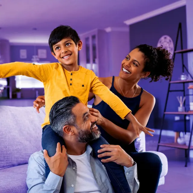 Image of a happy couple and their son