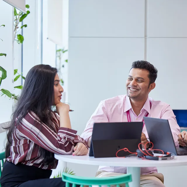 Image of officemates discussing in an office