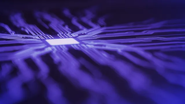 Close-up of a microchip with glowing circuit lines representing advanced semiconductor technology.
