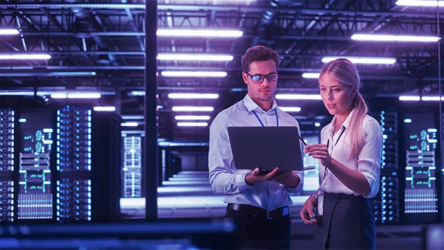 IT professionals collaborating in a modern data center.