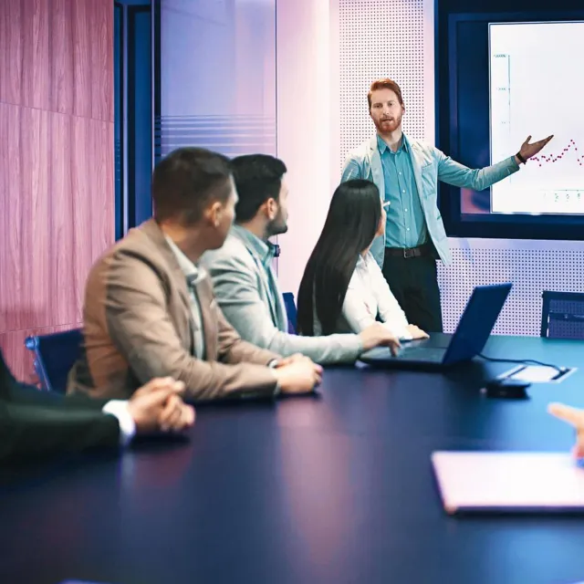 Image of man presenting to team