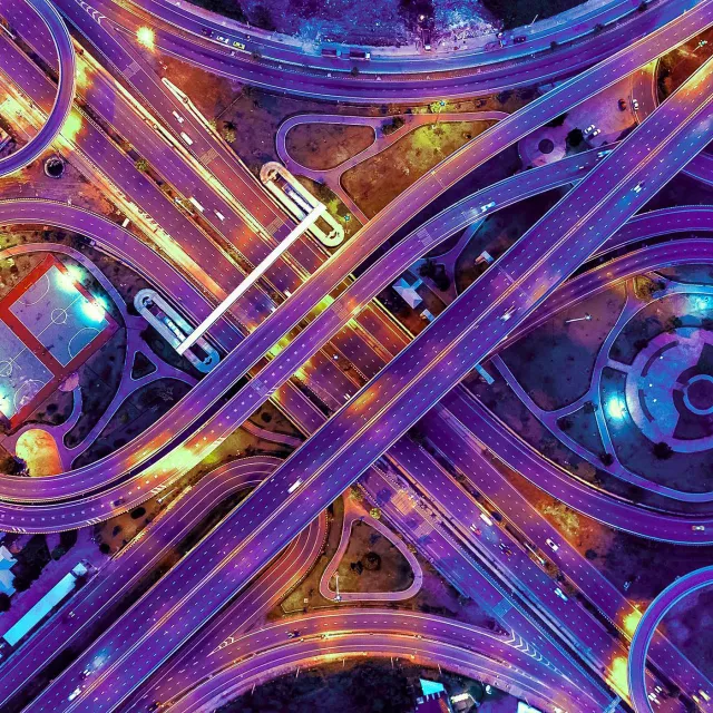 Image of bird's eye view of a highway road junction at night