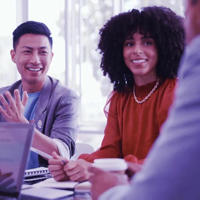 Image of officemates enjoying a meeting