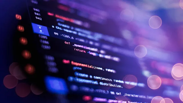 Abstract view of a computer screen showing code.