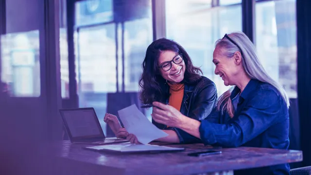Banking professionals reviewing loan documentation together