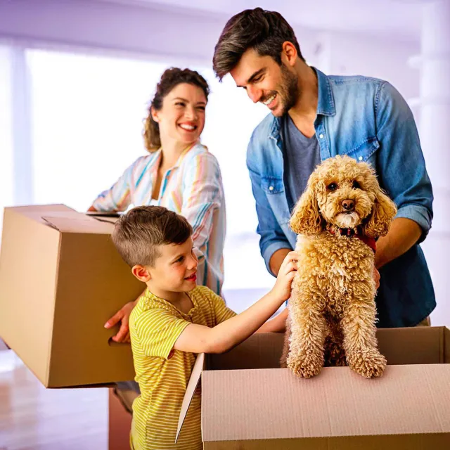 Young family moving in to their new home after a successful mortgage origination process